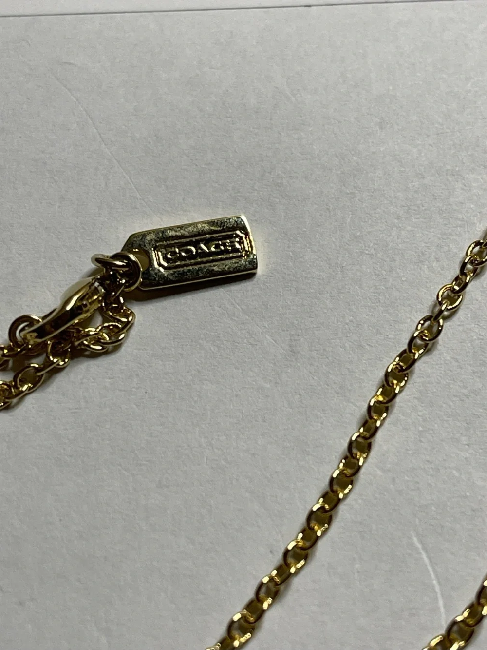 Coach Gold Pendant Necklace with Triple Medallion Reversible Charms